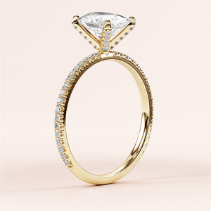 Elegant 14K yellow gold engagement ring with oval solitaire andPave accents, showcasing brilliant diamonds and intricate details.