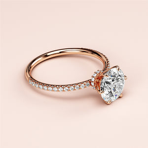 Elegant rose gold engagement ring featuring a round-cut diamond in aPave setting, available in 14K, 18K, and platinum options.