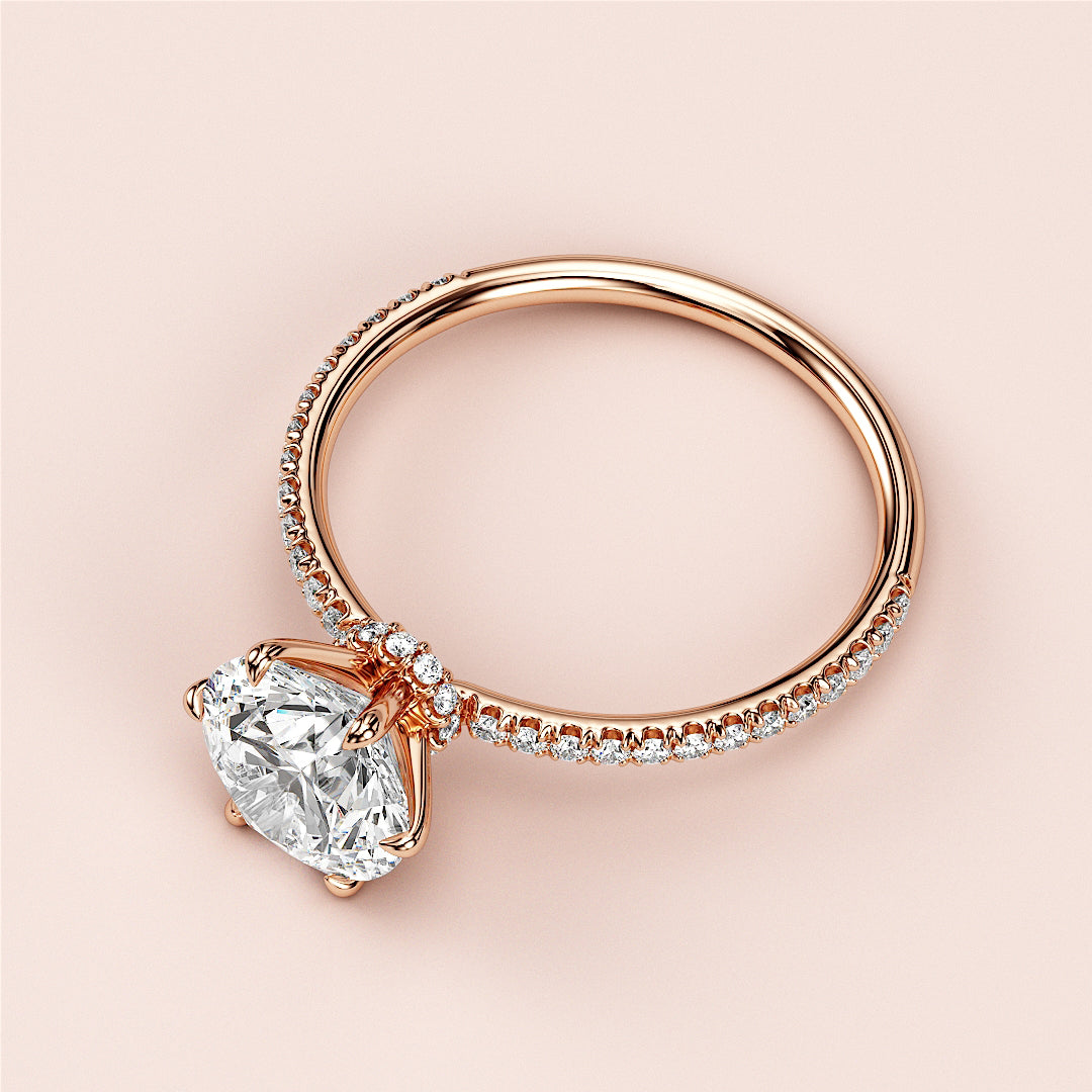 Elegant 14K or 18K rose gold solitaire oval diamond engagement ring with aPave band, showcasing timeless beauty.