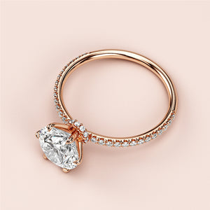 Elegant 14K or 18K rose gold solitaire oval diamond engagement ring with aPave band, showcasing timeless beauty.