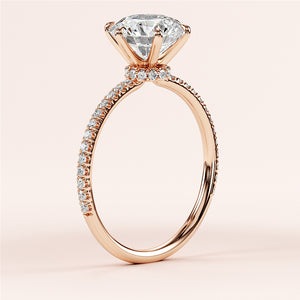 Elegant 14K rose gold engagement ring with round brilliant-cut diamond center andPave accents, showcasing timeless craftsmanship.
