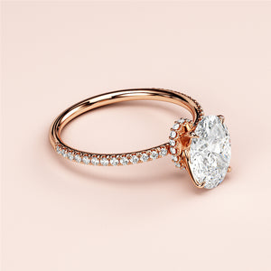 Exquisite 14K rose gold oval solitaire halo engagement ring with diamond accents, perfect for a timeless proposal.