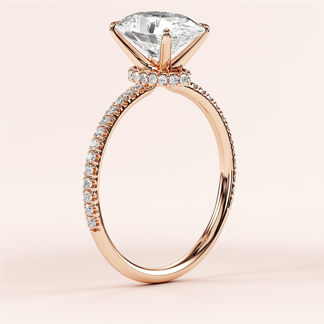 Stunning 14K rose gold engagement ring with marquise diamond in channel setting onPave band, perfect for timeless proposals.