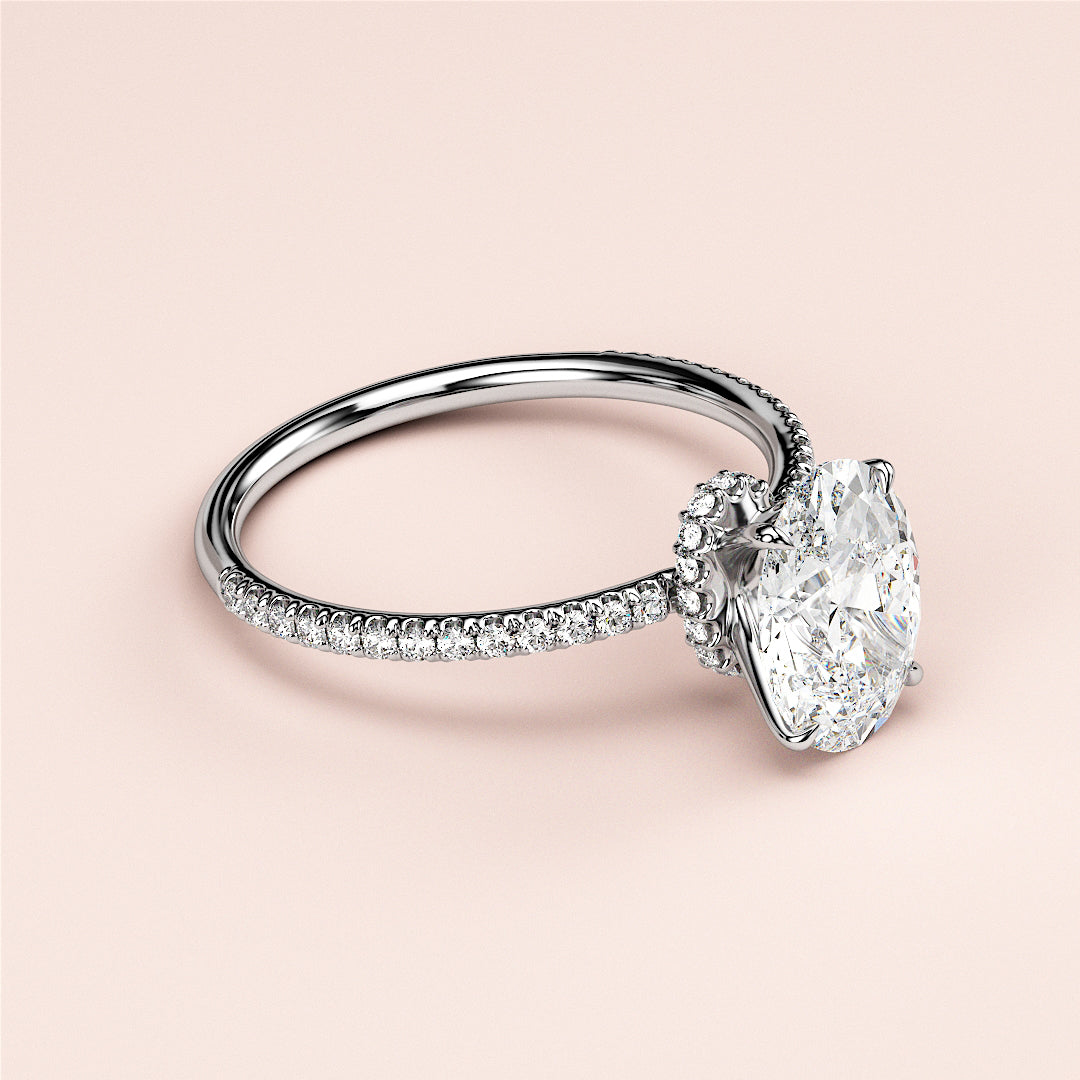 Oval diamond engagement ring withPave-set band, available in 14K, 18K gold, or platinum for a stunning look.