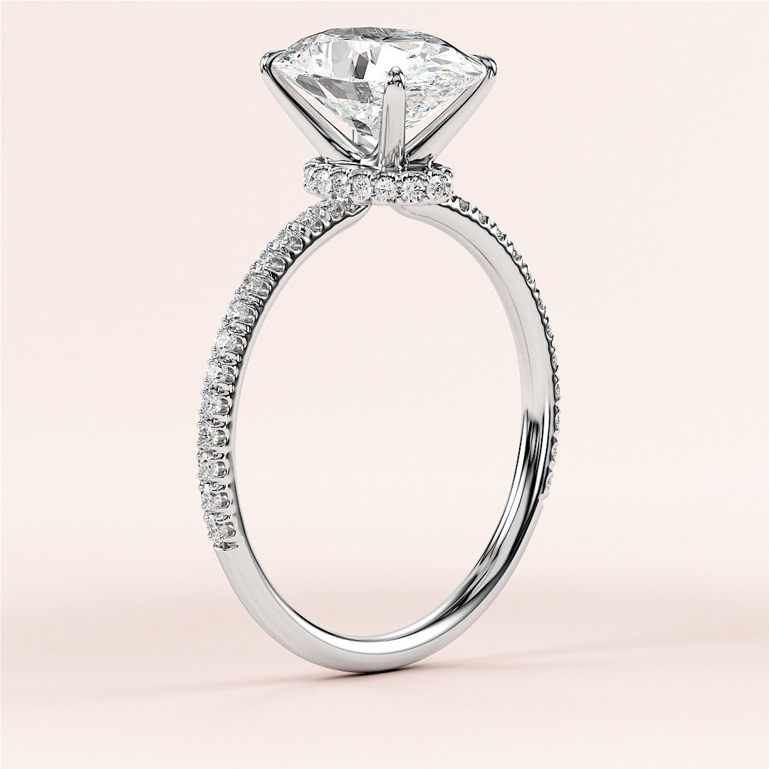 Elegant 14K or 18K gold or platinum engagement ring with an oval diamond center and a sparkling pave-set band.