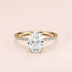Elegant yellow gold 14K or 18KPave band oval diamond engagement ring, showcasing a stunning center stone, worn on a model.