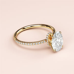 Elegant 14K yellow gold oval solitaire halo engagement ring with pave band, showcasing brilliance and sophistication.