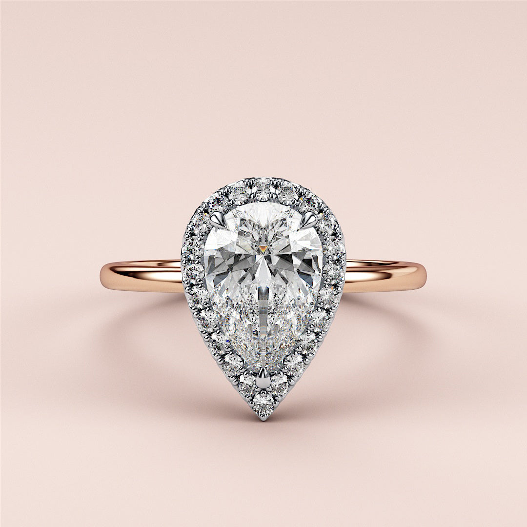 Elegant emerald-cut diamond engagement ring in 14K rose gold, worn on model, featuring a stunning pave band for a timeless look.|

#14KRecycledRose/WhiteGold
#18KRecycledRose/WhiteGold