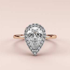 Elegant emerald-cut diamond engagement ring in 14K rose gold, worn on model, featuring a stunning pave band for a timeless look.
