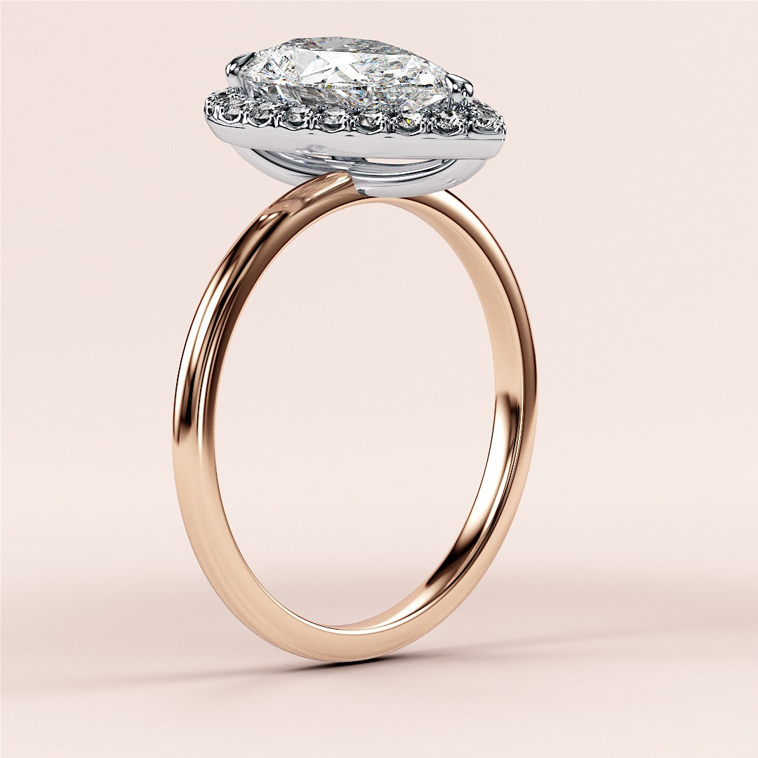 Elegant emerald-cut diamond engagement ring in 14K rose gold, worn on model, featuring a stunning pave band for a timeless look.|







#14KRecycledRoseGold
#18KRecycledRoseGold


