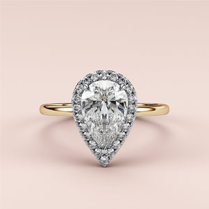 Radiant cut diamond engagement ring in 14K yellow gold with split-shank design and round diamond accents for a stunning look.