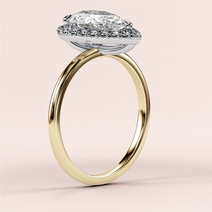Radiant cut diamond engagement ring in 14K yellow gold with split-shank design and round diamond accents for a stunning look.