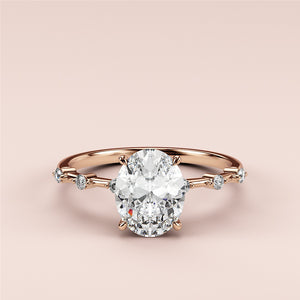 Elegant 14K rose gold engagement ring with an oval diamond centerpiece and shimmering round diamonds along the band.