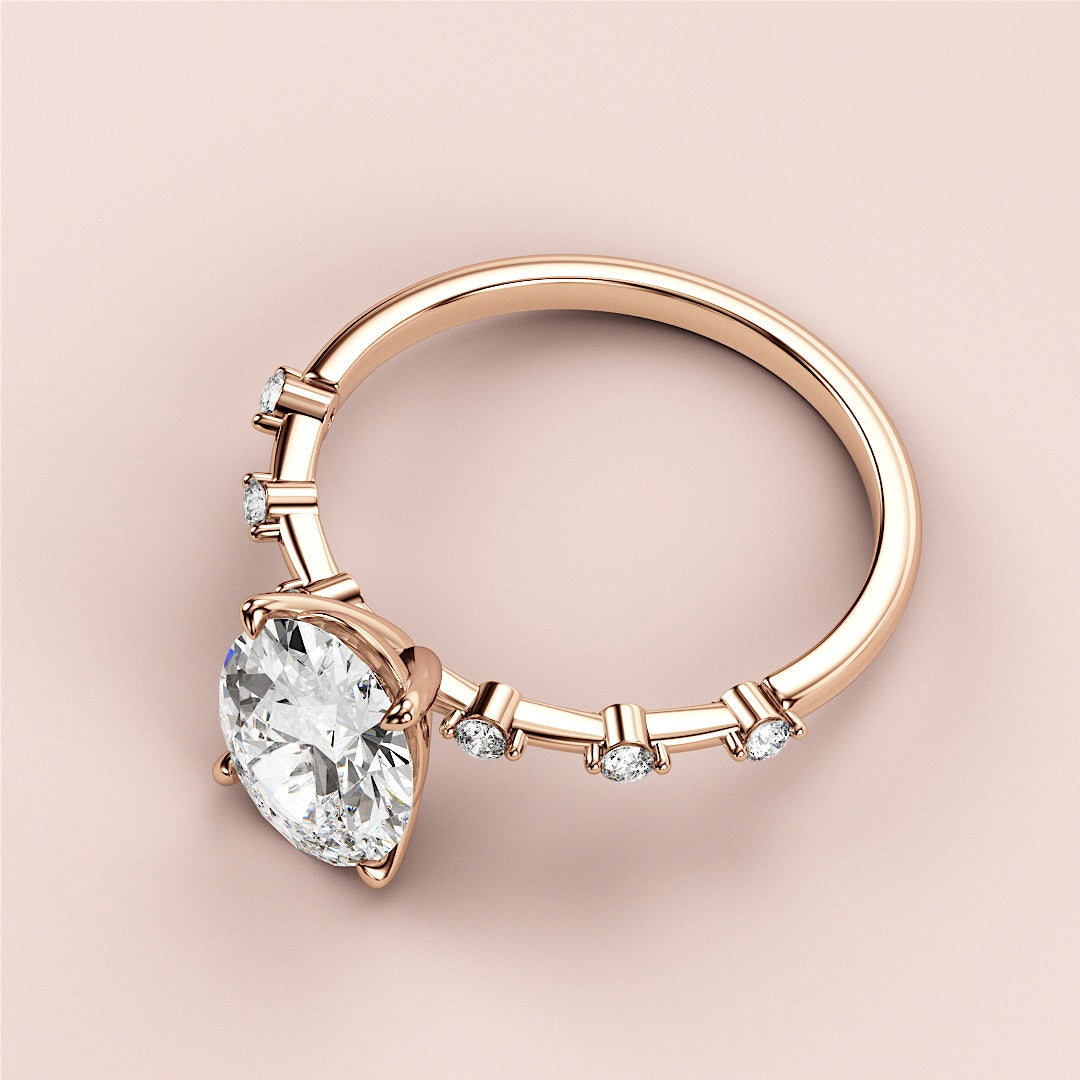 Elegant 14K rose gold engagement ring featuring an oval diamond centerpiece with twinkling accents, against a soft background.|







#14KRecycledRoseGold
#18KRecycledRoseGold



