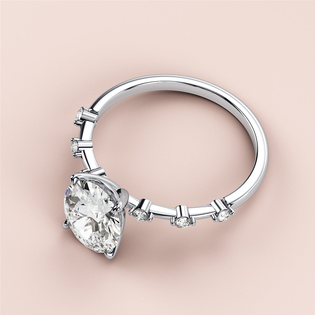 Elegant 14K white gold engagement ring featuring an oval diamond with round accent diamonds, perfect for timeless romance.|

#14KRecycledWhiteGold
#18KRecycledWhiteGold








#Platinum
