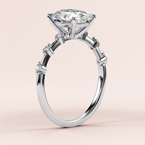 Elegant 14K white gold engagement ring featuring an oval diamond and round diamonds on the band, perfect for timeless romance.