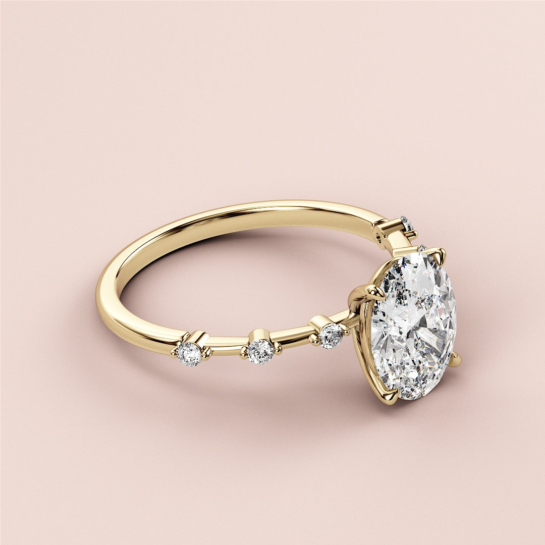 Elegant 14K/18K yellow gold engagement ring featuring an oval-cut diamond center stone and six brilliant side diamonds.|




#14KRecycledYellowGold
#18KRecycledYellowGold





