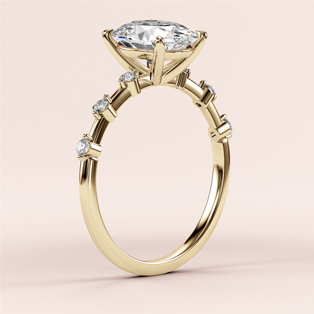 Elegant 14K and 18K gold engagement ring with oval diamond twinkles on band, adorned with side stones for a stunning finish.|




#14KRecycledYellowGold
#18KRecycledYellowGold





