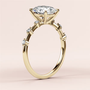 Elegant 14K and 18K gold engagement ring with oval diamond twinkles on band, adorned with side stones for a stunning finish.