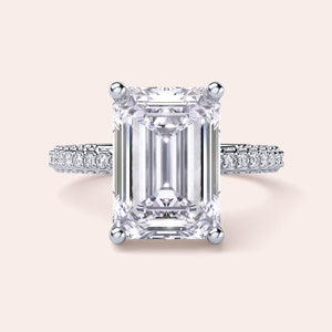 Elegant pear-shaped diamond engagement ring in 14K/18K gold or platinum, featuring a sparkling diamond-studded band.