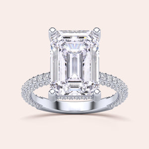 Close-up of a model wearing a 14K/18K/platinum pear-shaped diamond engagement ring withPave accents, showcasing timeless elegance.