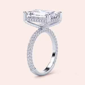 Close-up of a model wearing a 14K/18K/platinum pear-shaped diamond engagement ring withPave accents, showcasing timeless elegance.
