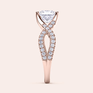 Elegant 14K rose gold engagement ring with twisted band, intricate diamond accents, ideal for a timeless proposal.