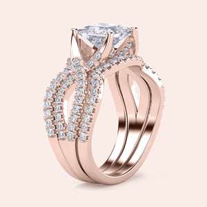 Rose gold engagement ring in 14K/18K/platinum with cushion-cut diamond and crisscross pave band design.