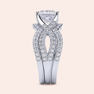 Elegant 14K or 18K white gold engagement ring set with a heart-shaped diamond and twisted pave band, perfect for timeless sophistication.