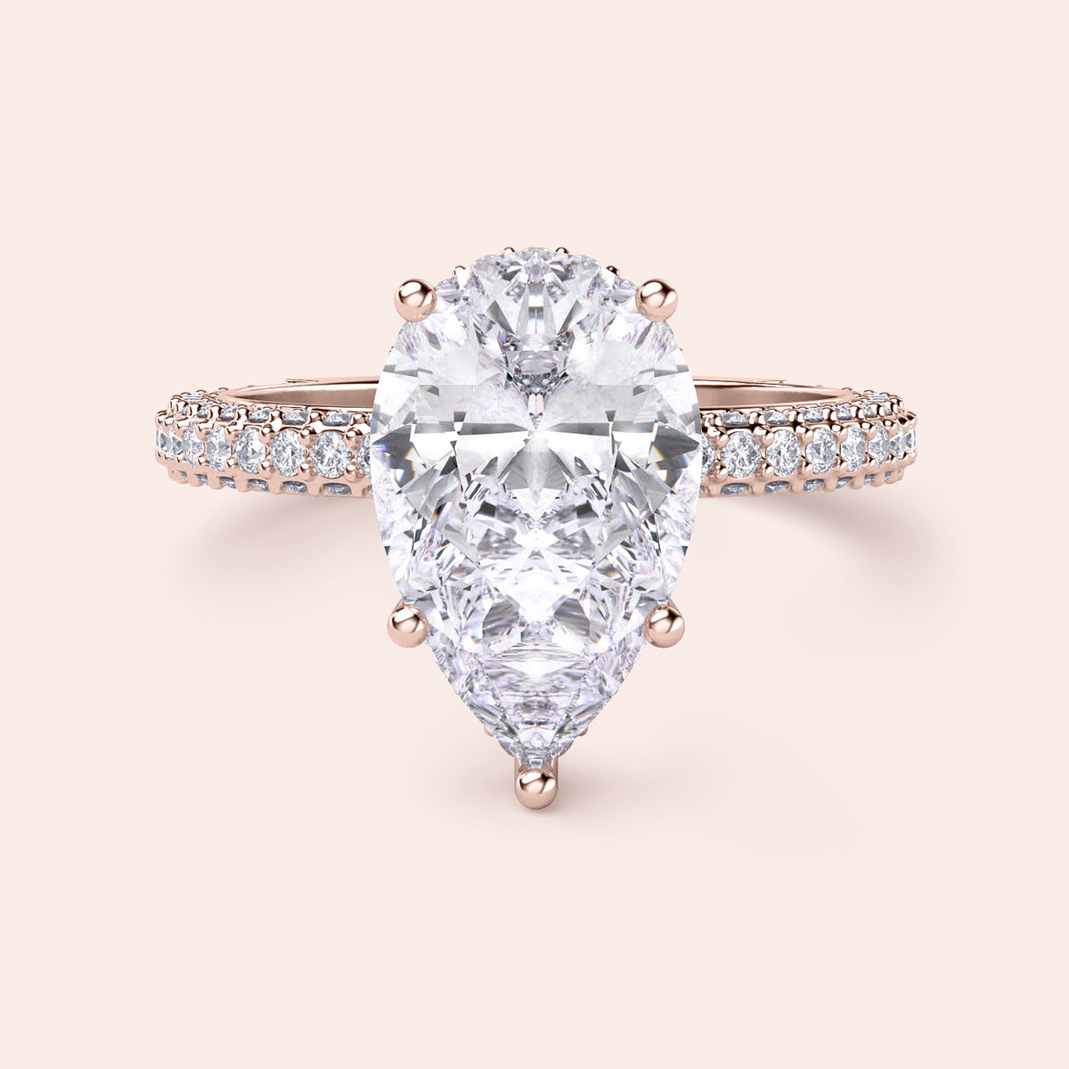 Rose Gold pear-shaped diamond engagement ring withPave band, available in 14K/18K gold or platinum, features an exquisite centerpiece.