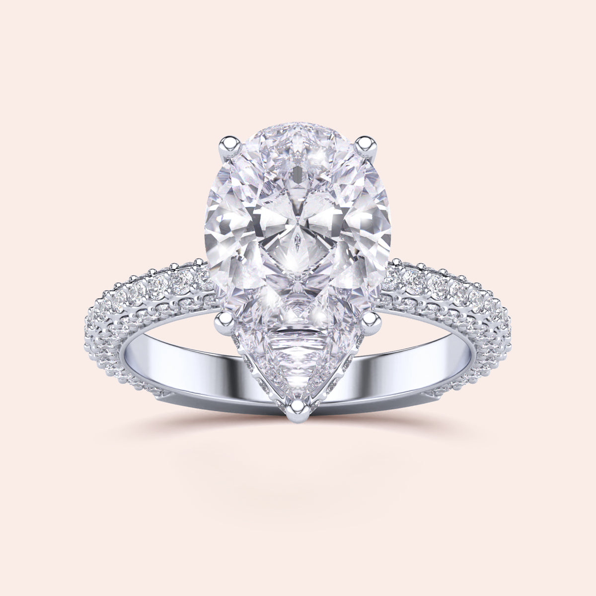 Elegant 14K/18K white gold engagement ring featuring a pear-shaped diamond with a hidden halo and pave accents.