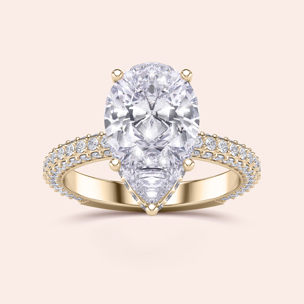 14K yellow gold engagement ring with pear-shaped diamond andPave diamond accents, showcasing luxury and elegance.