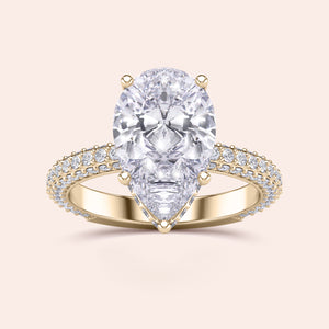 14K yellow gold engagement ring with pear-shaped diamond andPave diamond accents, showcasing luxury and elegance.