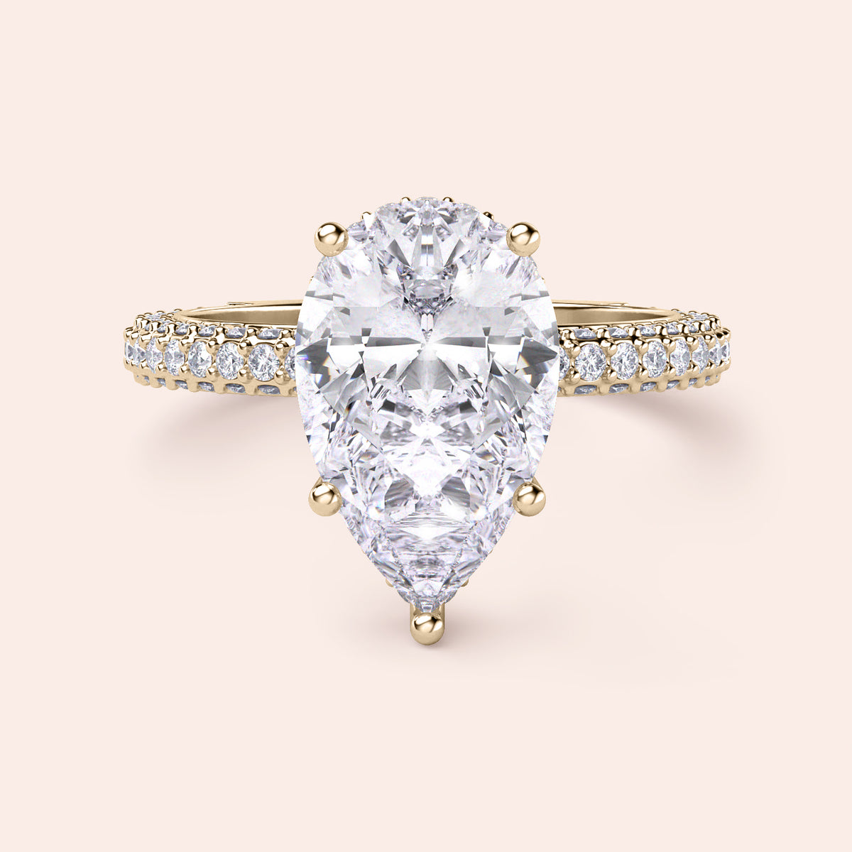 Exquisite pear-shaped diamond ring in 14K/18K gold or platinum, adorned with halo diamond accents for an elegant touch.