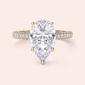 Exquisite pear-shaped diamond ring in 14K/18K gold or platinum, adorned with halo diamond accents for an elegant touch.