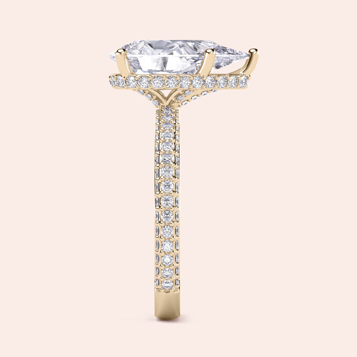 Elegant 14K yellow gold engagement ring featuring a pear-shaped diamond with hidden halo andPave accents.