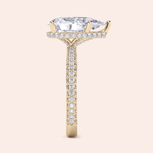 Elegant 14K yellow gold engagement ring featuring a pear-shaped diamond with hidden halo andPave accents.