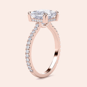 Rose gold engagement ring with oval diamond center andPave band in 14K/18K gold or platinum, elegantly worn on model's finger.