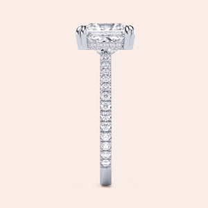Elegant white gold engagement ring featuring an emerald-cut diamond and a pave band, available in 14K, 18K, and platinum settings.