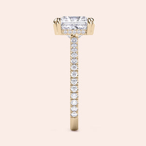 Elegant yellow gold engagement ring featuring a princess-cut diamond with a hidden halo and pave band, available in 14K or 18K.