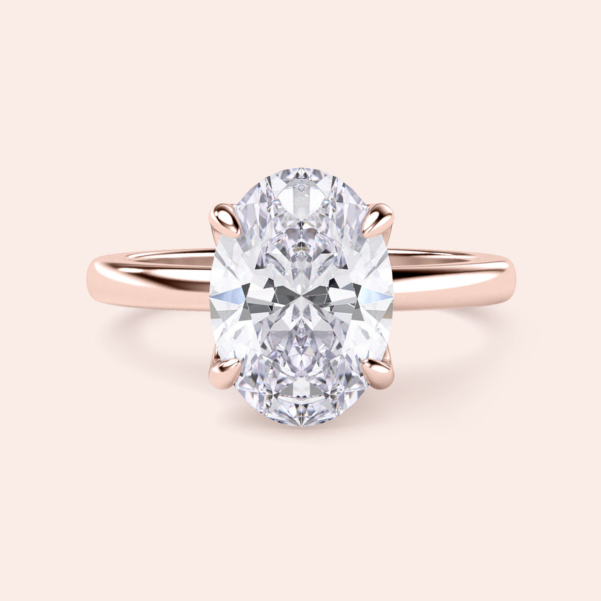 Oval-shaped diamond engagement ring in 14K rose gold, detailed close-up view, perfect for a romantic proposal.