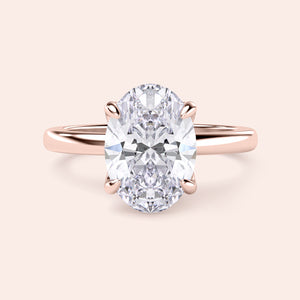 Oval-shaped diamond engagement ring in 14K rose gold, detailed close-up view, perfect for a romantic proposal.