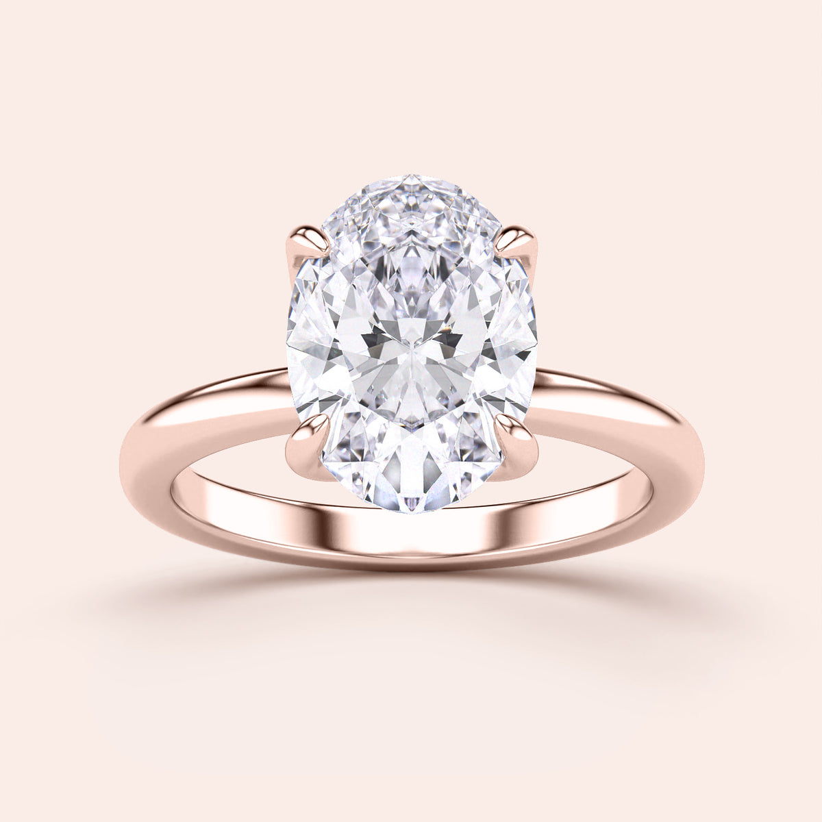 Elegant rose gold 14K/18K oval diamond solitaire engagement ring with a timeless design, featuring a stunning oval-shaped diamond.