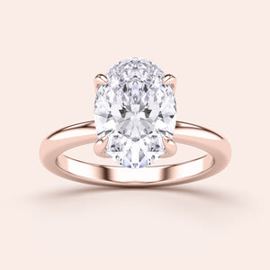 Elegant rose gold 14K/18K oval diamond solitaire engagement ring with a timeless design, featuring a stunning oval-shaped diamond.