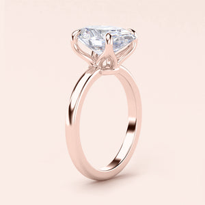 Elegant 14K or 18K rose gold engagement ring with marquise-cut diamond in a sleek solitaire band.