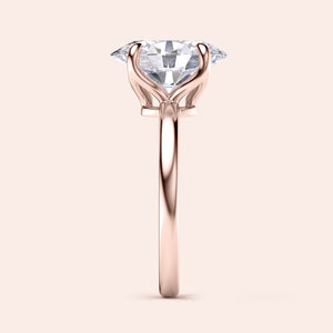 "Elegant 14K rose gold engagement ring with sparkling heart-shaped diamond in a stunning tulip mount design."