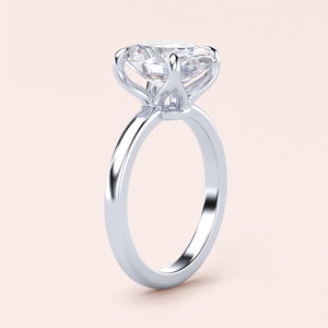 "Elegant white gold solitaire engagement ring with a round diamond, available in 14K or 18K gold or platinum."
