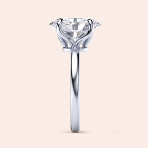 Elegant solitaire engagement ring with a heart-shaped diamond in a 14K or 18K white gold band, displayed on a neutral background.
