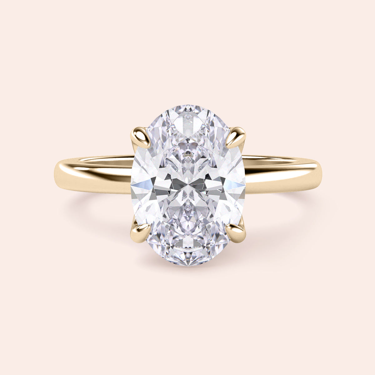 14K Yellow Gold engagement ring featuring an elegant oval diamond shape in a tulip mount with a plain band.