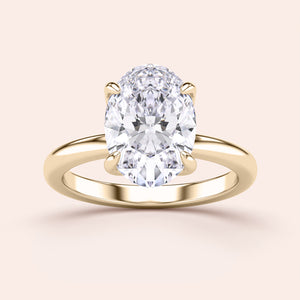 "Elegant oval tulip mount solitaire ring in 14K yellow gold, featuring a timeless design for engagement or special occasions."